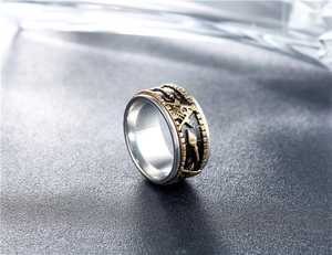 Macro detail of vintage bicolor Freemason spinner ring with engraved Masonic symbols