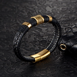 Men's braided black leather bracelet with elegant gold magnetic clasp and metal rings