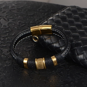 Men's black woven leather bracelet with three gold metallic beads and magnetic clasp