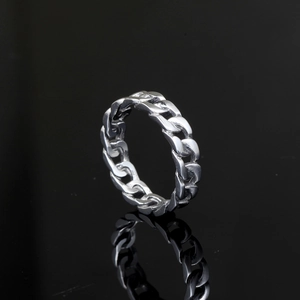 Men's punk stainless steel Cuban link ring shown with reflection on black background
