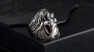 Detailed view of punk style stainless steel ring with 3D female sculpture design