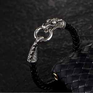 Retro stainless steel dragon head clasp on black braided leather bracelet for men