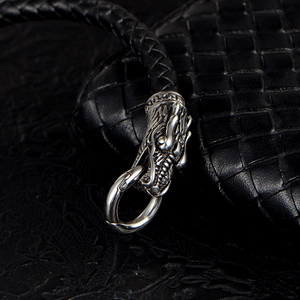 Braided leather bracelet for men featuring a detailed vintage silver dragon head clasp