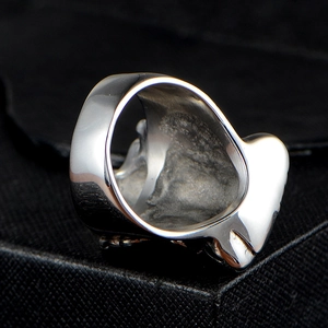 Polished silver stainless steel ring with vintage punk engraving on a jewelry box