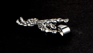 Detailed view of silver stainless steel muscular bodybuilder pendant with metal hook
