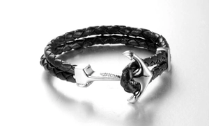 Close-up of double-layered black woven leather cord and silver anchor clasp detail