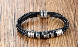 Detail of multi-layer black leather bracelet for men with textured steel beads and magnetic clasp