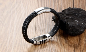 Detail of black braided leather bracelet for men with silver magnetic stainless steel clasp