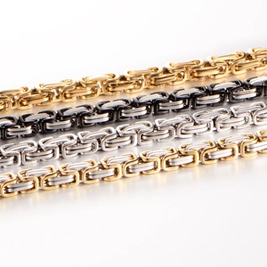 Macro shot of 316L stainless steel Byzantine chain necklaces in four metallic colors