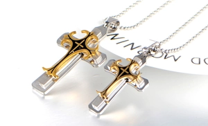 Detail of two-tone triple layer stainless steel cross pendants on beaded chain