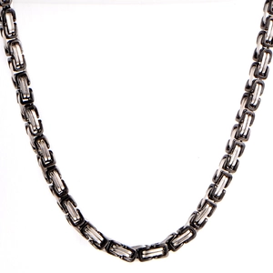 Close-up of Byzantine chain links in black and silver polished 316L stainless steel
