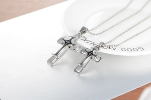 Macro shot of layered stainless steel cross pendants on a classic bead chain