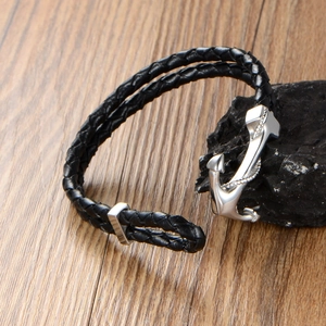 Braided black leather anchor bracelet with silver stainless steel charm on black stone