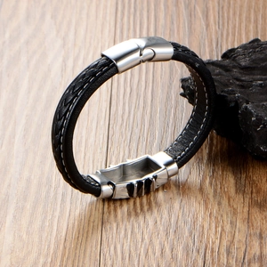 Men's punk braided leather bracelet with silver magnetic metal clasp on stone background