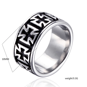 Macro detail of 10mm wide vintage stainless steel ring with hollow cross engraving