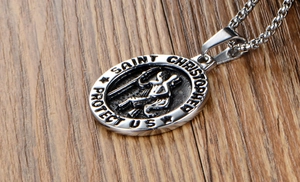 Macro view of Saint Christopher medal pendant engraved with Saint Christopher Protect Us