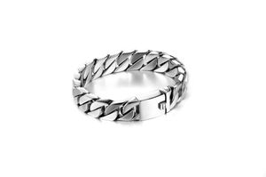Detailed view of polished silver cuban link chain bracelet with a square clasp for men