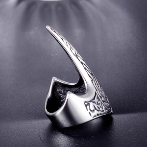 Macro shot of punk style eagle claw ring with detailed vintage floral engravings