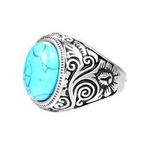 Vintage titanium steel ring featuring an oval turquoise stone and intricate carved patterns