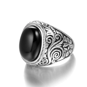Vintage men's titanium steel ring featuring an oval black gemstone and intricate floral carving