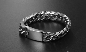 Macro shot of polished silver Cuban link bracelet with heavy duty rectangular buckle