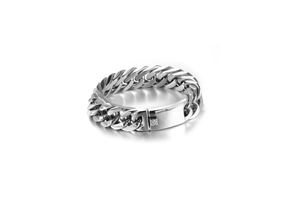 Close-up of thick silver Cuban link bracelet with a textured rectangular pressure clasp
