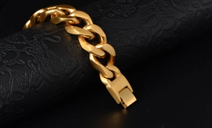 Detail of matte gold Cuban link bracelet for men with brushed texture and fold-over clasp
