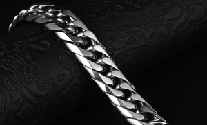 Macro detail of high-polish thick cuban link bracelet for men in stainless steel