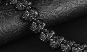 Macro shot of 316L stainless steel skull head bracelet with detailed gothic carving