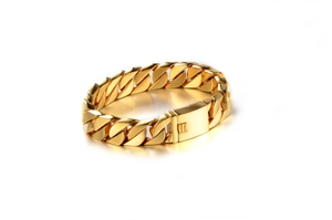 Close-up of golden stainless steel Cuban link bracelet with high polish finish and box clasp