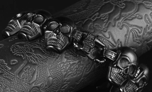 Macro shot of matte black 316L stainless steel skull chain bracelet with gothic design