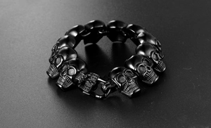 Detailed macro shot of gothic 316L black steel skull link bracelet with sturdy clasp
