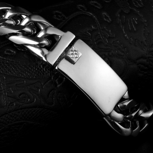 Polished silver stainless steel Cuban link bracelet with rectangle buckle on black leather