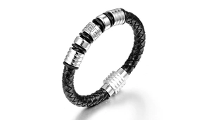 Detail of black braided leather bracelet with silver Greek meander metal beads