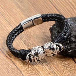 Punk woven leather bracelet with double silver skulls and magnetic steel clasp