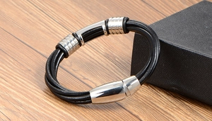 Close-up of braided leather bracelet with stainless steel magnetic clasp and gift box