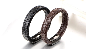 Close-up of woven leather bracelets in black and dark brown with magnetic metal clasps