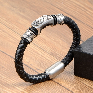 Braided black leather men's bracelet with vintage engraved stainless steel accents