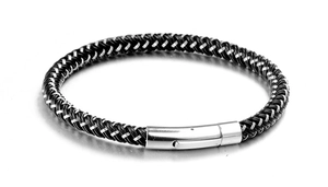 Detail of woven stainless steel bracelet with silver metal cylinder magnetic clasp