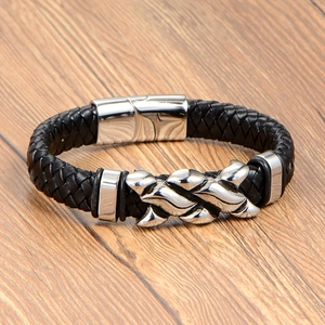 Men's black braided leather bracelet with wavy metal charm and polished magnetic clasp