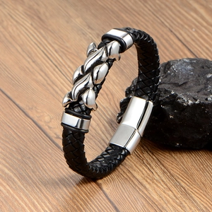 Men's black braided leather bracelet with silver flame-shaped stainless steel magnetic clasp