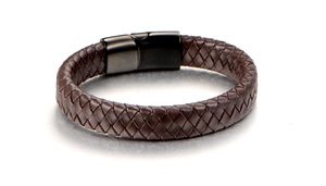Detailed close-up of dark brown braided leather strap with black magnetic metal clasp
