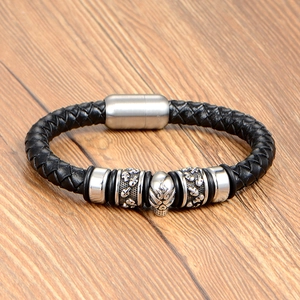 Classic black braided leather bracelet for men featuring a silver punk skull center piece
