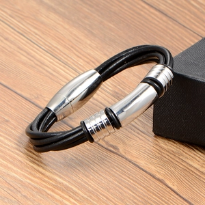 Braided black leather bracelet for men featuring a polished magnetic steel clasp