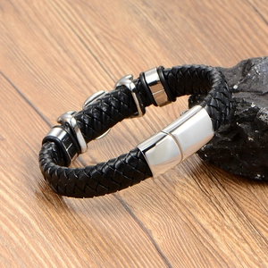 Men's braided black leather bracelet with flame style metal charms and magnetic clasp