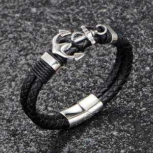 Retro nautical braided leather bracelet with a silver metal anchor charm and magnetic clasp