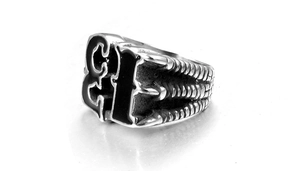 Detailed close-up of retro stainless steel men's ring featuring black numeral 13 design