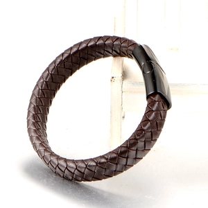 Minimalist woven brown leather bracelet for men featuring a black magnetic metal clasp