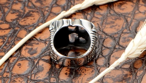 Macro view of men's stainless steel ring with lucky number 13 and vintage grid texture