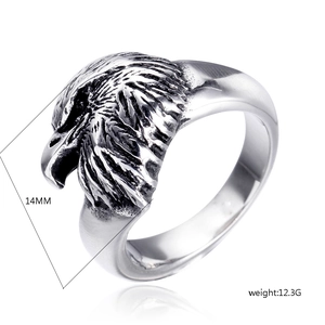 Detailed macro view of 14mm eagle head punk ring showing carved feather texture and weight